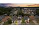 Aerial view of the community showcasing lush landscaping, mature trees, and multiple well-maintained single Gathering homes at 5672 Parkview Lake Dr, Orlando, FL 32821