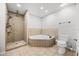 Bathroom featuring shower, soaking tub, tile flooring, and neutral paint at 5672 Parkview Lake Dr, Orlando, FL 32821