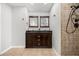 Bathroom featuring double vanity with dark wood cabinets, tile flooring and neutral paint at 5672 Parkview Lake Dr, Orlando, FL 32821