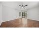 Bedroom featuring hardwood floors, a ceiling fan, white walls, and natural light at 5672 Parkview Lake Dr, Orlando, FL 32821