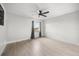 Bright bedroom featuring wood-look floors and a ceiling fan at 5672 Parkview Lake Dr, Orlando, FL 32821