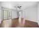 Spacious bedroom with hardwood flooring, a ceiling fan, and neutral colored walls at 5672 Parkview Lake Dr, Orlando, FL 32821