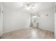 Bright bedroom featuring wood-look floors and a ceiling fan at 5672 Parkview Lake Dr, Orlando, FL 32821