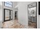 Inviting foyer boasting tile floors with a front door and adjacent half bathroom at 5672 Parkview Lake Dr, Orlando, FL 32821