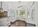Eat in kitchen nook with large windows, custom cabinetry, granite countertops and natural light at 5672 Parkview Lake Dr, Orlando, FL 32821