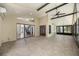 Bright sunroom with tile flooring, neutral walls, a ceiling fan and access to the rest of the home at 5672 Parkview Lake Dr, Orlando, FL 32821