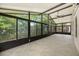 Bright sunroom with floor to ceiling windows allowing lots of natural light into the home at 5672 Parkview Lake Dr, Orlando, FL 32821