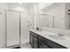 Modern bathroom featuring double sinks, a spacious shower with glass doors, and stylish fixtures at 6834 Wilson Hammock Ave, Groveland, FL 34736