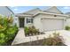 A charming home with a well-manicured lawn and a welcoming front entrance at 6834 Wilson Hammock Ave, Groveland, FL 34736