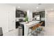 Modern kitchen with a large island, stainless steel appliances, and sleek cabinetry at 6834 Wilson Hammock Ave, Groveland, FL 34736