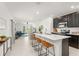 Modern kitchen with stainless steel appliances, and a breakfast bar at 6834 Wilson Hammock Ave, Groveland, FL 34736