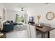 Inviting living area with a comfortable sectional, area rug, dining table, and access to a backyard view at 6834 Wilson Hammock Ave, Groveland, FL 34736