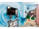 Themed ' bedroom with a flat-screen TV, ocean mural, and fun decorations at 7224 Oakmoss Loop, Davenport, FL 33837