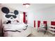 bedroom with Mickey Mouse themed decor, decor and furnishings at 7224 Oakmoss Loop, Davenport, FL 33837