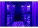A bedroom has custom bunk beds with neon lights, creating a playful and imaginative space at 7224 Oakmoss Loop, Davenport, FL 33837