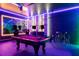 Bright game room with pool table, bar seating, and unique custom lighting at 7224 Oakmoss Loop, Davenport, FL 33837