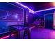 Spacious game room with foosball, basketball arcade, and unique custom lighting at 7224 Oakmoss Loop, Davenport, FL 33837