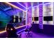 An unique gaming room equipped with screens, gaming chairs, and custom LED lighting at 7224 Oakmoss Loop, Davenport, FL 33837