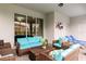Covered patio with comfortable outdoor seating and stylish decor at 7224 Oakmoss Loop, Davenport, FL 33837