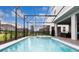 Screened-in pool and spa area offers a private outdoor oasis for relaxation at 7224 Oakmoss Loop, Davenport, FL 33837