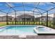 Sparkling pool and spa are nestled within a screened lanai, ideal for relaxation at 7224 Oakmoss Loop, Davenport, FL 33837