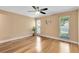 Bedroom showcasing hardwood floors, ceiling fan, and natural lighting with multiple windows at 7249 Abbey Ln, Winter Park, FL 32792