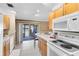 Functional kitchen offers sleek appliances, ample counter space, and access to the patio at 7249 Abbey Ln, Winter Park, FL 32792