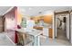Bright kitchen with wood cabinets, updated countertops, tile floor, and breakfast bar seating at 7249 Abbey Ln, Winter Park, FL 32792