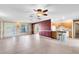 Bright and airy living room featuring neutral tile flooring and an open layout to the kitchen at 7249 Abbey Ln, Winter Park, FL 32792