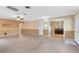Open-concept living room with tile flooring and neutral color palette. Lots of natural light at 7249 Abbey Ln, Winter Park, FL 32792