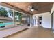 Screened in patio featuring neutral walls, stained wood ceiling, and a view of the fenced-in backyard at 7249 Abbey Ln, Winter Park, FL 32792