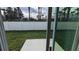 A fenced-in backyard with green grass offers a private outdoor space for relaxation and recreation at 7612 Danube Rd, Kissimmee, FL 34746