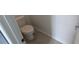 Powder room with modern toilet and base trim at 7612 Danube Rd, Kissimmee, FL 34746