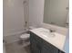 A well-lit bathroom includes a tub with tile surround, vanity, and fixtures at 7612 Danube Rd, Kissimmee, FL 34746