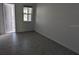 Bedroom with tile flooring, neutral walls and natural light at 7612 Danube Rd, Kissimmee, FL 34746