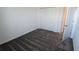 Neutral bedroom with closet, carpet flooring and a door leading to another room at 7612 Danube Rd, Kissimmee, FL 34746
