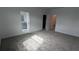 Spacious bedroom with neutral carpet and ensuite bathroom at 7612 Danube Rd, Kissimmee, FL 34746
