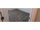 Bedroom with carpet flooring, door, and lots of natural light at 7612 Danube Rd, Kissimmee, FL 34746