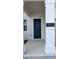 Stylish front door with house number and modern design at 7612 Danube Rd, Kissimmee, FL 34746