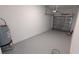 Clean garage interior with epoxy flooring and a water heater at 7612 Danube Rd, Kissimmee, FL 34746