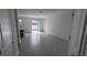 Spacious living area with tile flooring and sliding glass doors at 7612 Danube Rd, Kissimmee, FL 34746