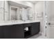 Bright bathroom boasts double sink vanity, modern fixtures, and ample counter space at 7740 Sandy Ridge Dr # 216, Reunion, FL 34747