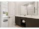 Bright bathroom boasts double sink vanity, modern fixtures, and a stylish shower at 7740 Sandy Ridge Dr # 216, Reunion, FL 34747
