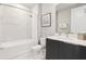 This bathroom features a tub, shower, sleek vanity, and modern toilet at 7740 Sandy Ridge Dr # 216, Reunion, FL 34747