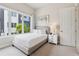 Bright bedroom with a minimalist decor, ample natural light, and neutral decor at 7740 Sandy Ridge Dr # 216, Reunion, FL 34747