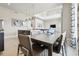 Open dining area featuring a modern light fixture, and views into the living room at 7740 Sandy Ridge Dr # 216, Reunion, FL 34747