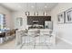 Stylish kitchen with a quartz countertop island, stainless steel appliances, and modern pendant lighting at 7740 Sandy Ridge Dr # 216, Reunion, FL 34747