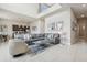 Bright, open-concept living room with soaring ceilings, modern decor, and a comfortable sectional sofa at 7740 Sandy Ridge Dr # 216, Reunion, FL 34747
