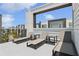 Relax on this rooftop patio with lounge chairs and views of the neighborhood at 7740 Sandy Ridge Dr # 216, Reunion, FL 34747