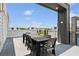 Private roof deck offering ample seating and outdoor dining with neighborhood views at 7740 Sandy Ridge Dr # 216, Reunion, FL 34747